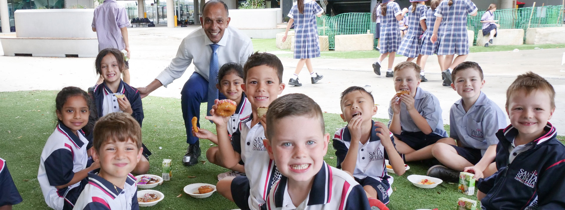 Santa Sophia Catholic College Box Hill dedicated principal and students enjoying recess