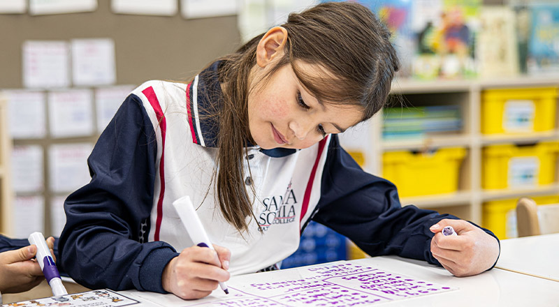 Santa Sophia Catholic College Box Hill student writing