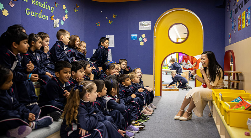 Santa Sophia Catholic College Box Hill dedicated teacher reading to students