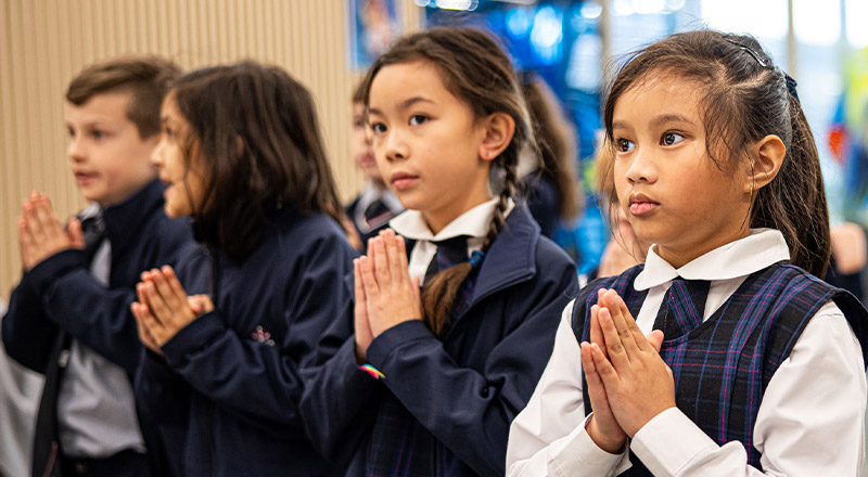 Santa Sophia Catholic College Box Hill students praying