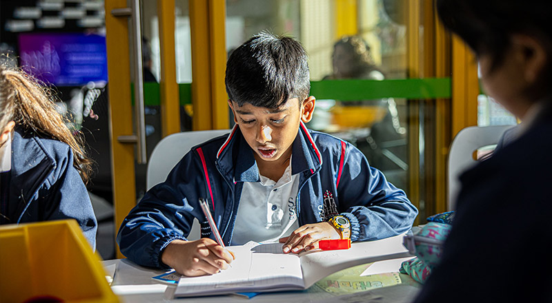 Santa Sophia Catholic College Box Hill students using laptops