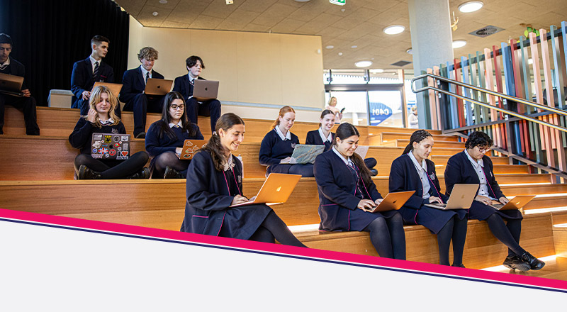 Santa Sophia Catholic College Box Hill students sitting on staircase