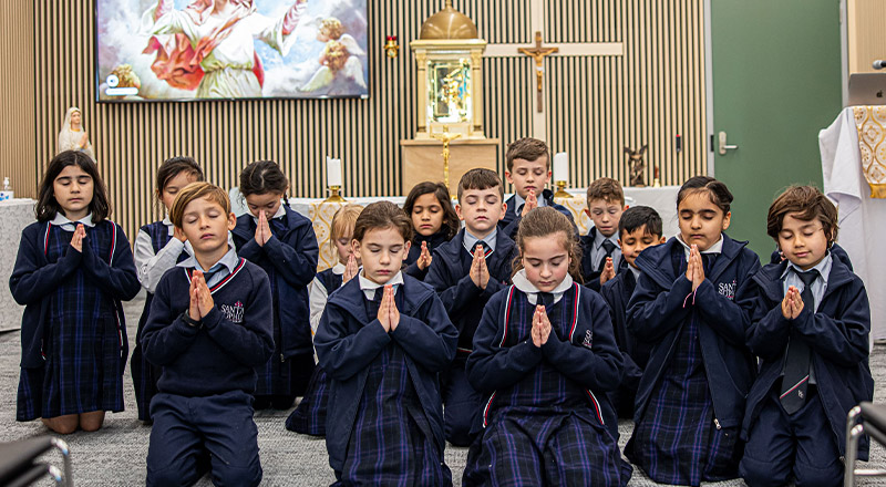 Santa Sophia Catholic College Box Hill students praying