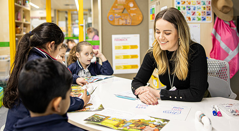 Santa Sophia Catholic College Box Hill students learning with dedicated teacher