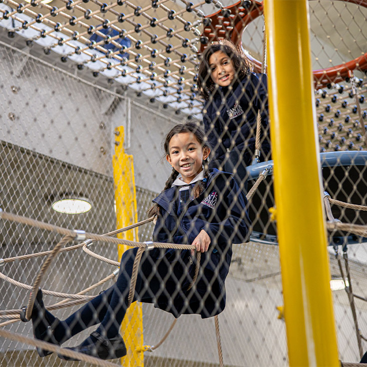 Santa Sophia Catholic College Box Hill students in play equipment
