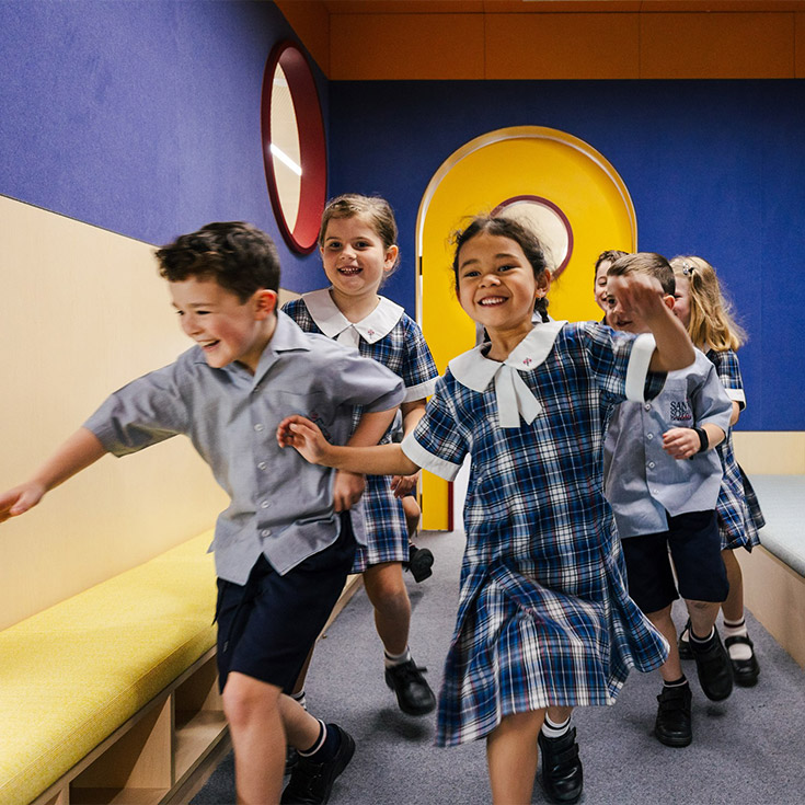 Santa Sophia Catholic College Box Hill students running on campus
