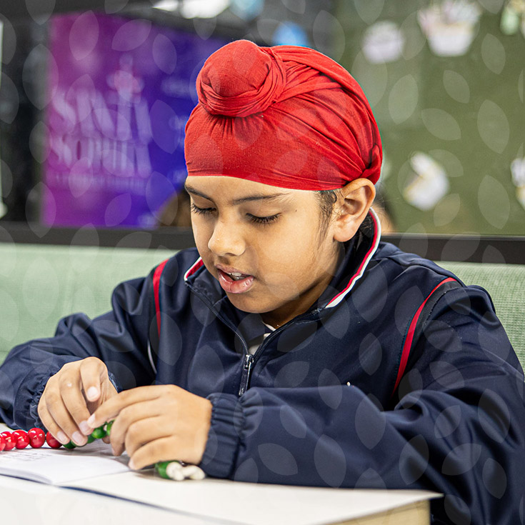 Santa Sophia Catholic College Box Hill student counting on beads