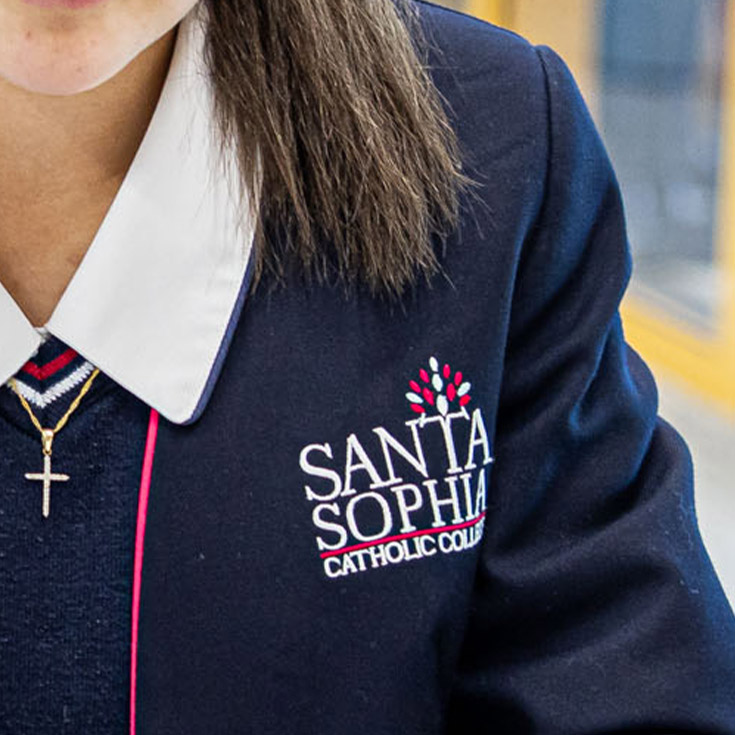 close up shot of Santa Sophia Catholic College Box Hill logo on uniform