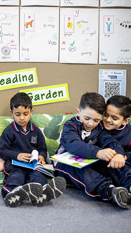Santa Sophia Catholic College students sitting in Reading Garden